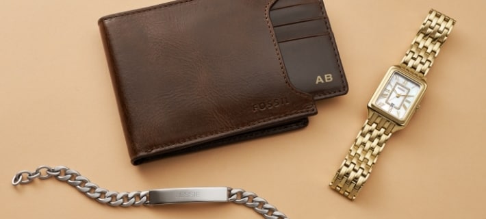 A brown leather wallet; a gold-tone Raquel watch and a silver-tone bracelet. 