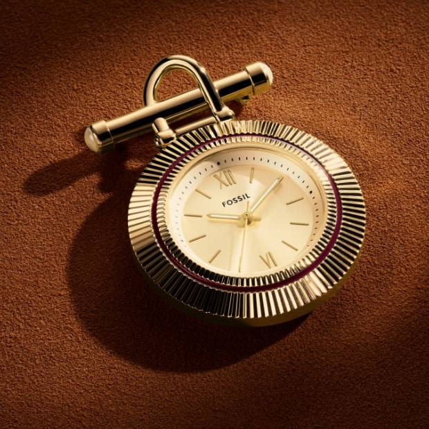 The gold-tone Scarlette brooch.
