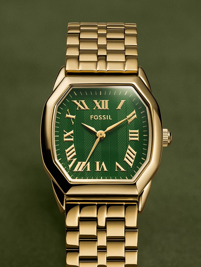 A close-up of the Harlow watch in a gold-tone finish with a green textured dial.