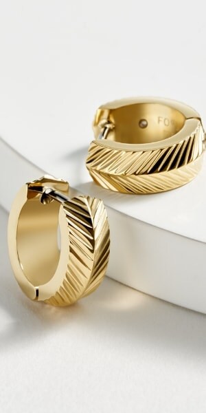 The gold-tone earrings in the Harlow Linear Collection.