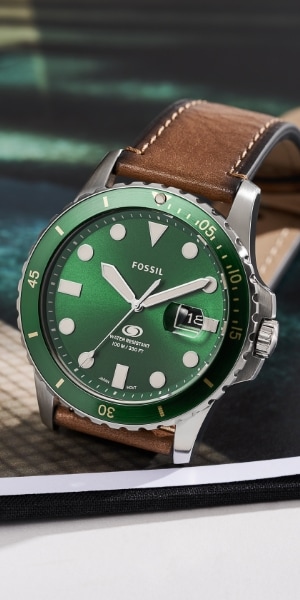 A men’s Fossil Blue watch with a green dial.