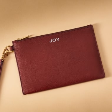 A women’s leather wristlet.