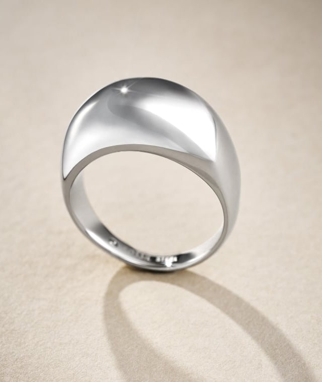 A silver-tone dome ring.