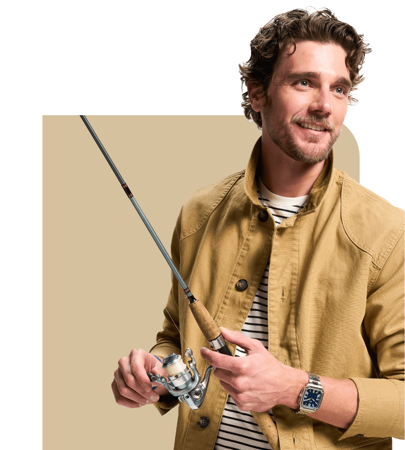 Dad wearing watch while holding a fishing rod.