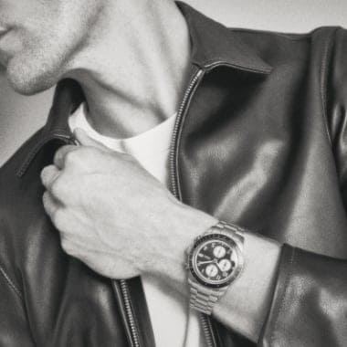 A black and white image of a man wearing the Sport Tourer watch.