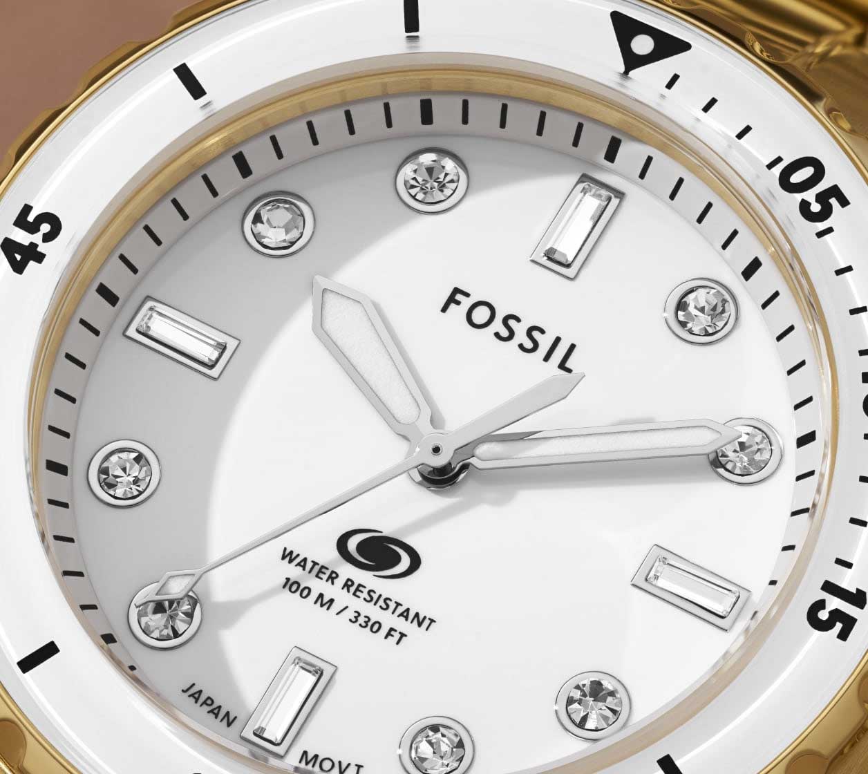 A closeup of the Fossil Blue Dive's dial, featuring crystal indices.