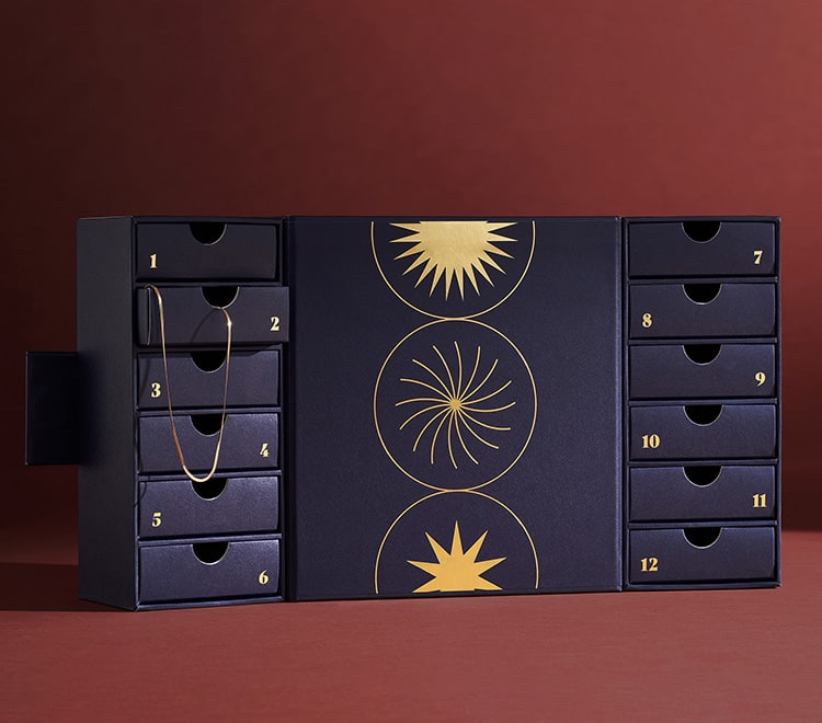 A GIF of the gift set featuring 12 drawers that open and close to reveal pieces of jewellery.