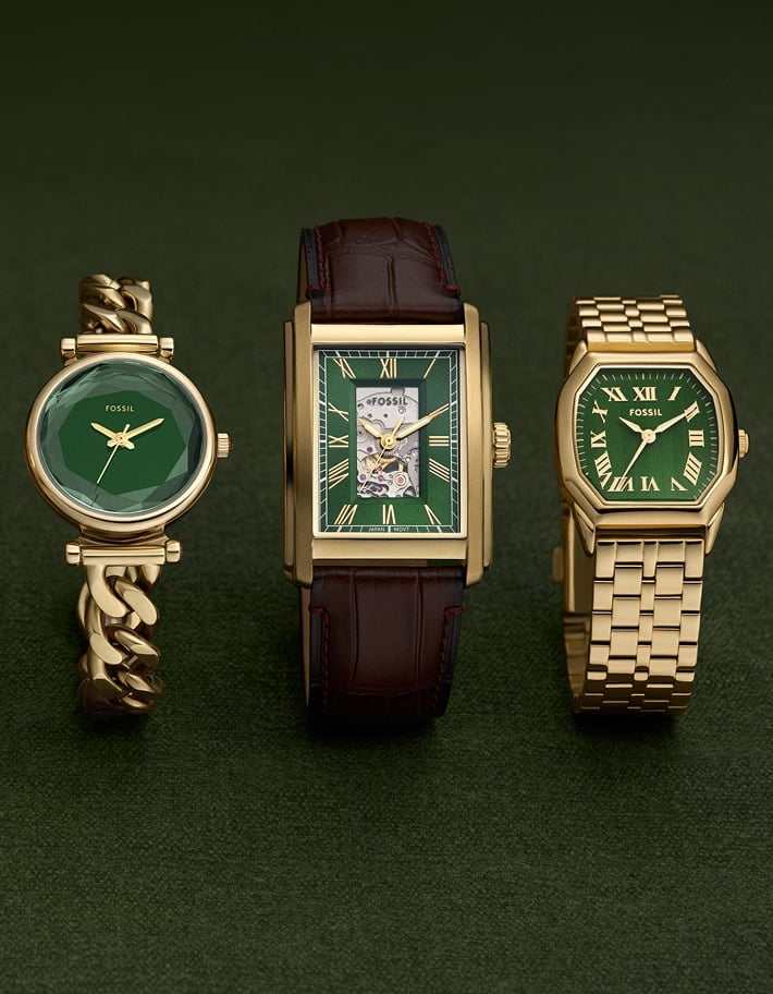 Three gold-tone watches featuring a deep green dial.