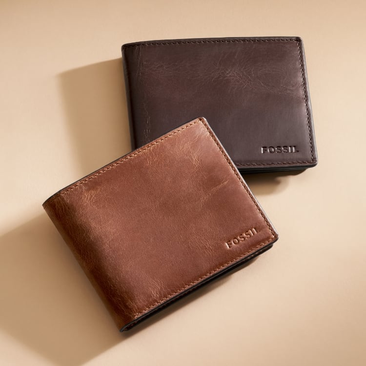 Two brown leather men's wallets.