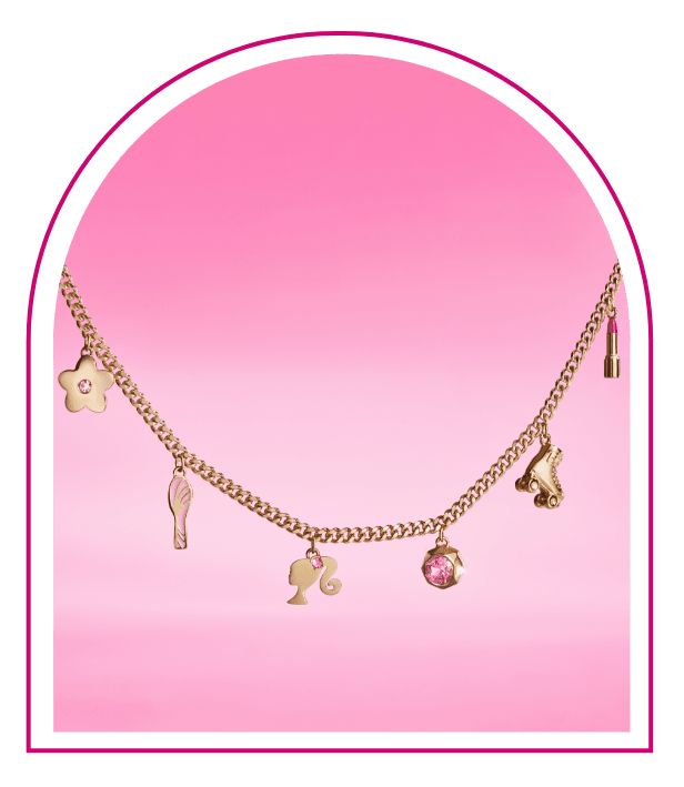 A pink background with a Barbie™ Mansion-inspired window. Inside the window sits our limited-edition Barbie™ x Fossil Gold-Tone Charm Bracelet, featuring a variety of Barbie-inspired charms with pink crystal embellishments, like a flower, a roller skate and a stylish Barbie silhouette.