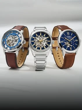 Three Automatic Watches with blue dials on a silvery background.