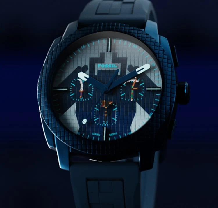 Minecraft x Fossil「ツイステッド・ウォーデン」ウォッチは、さまざまな色合いのブルーのピクセル調ダイヤルにシルエットが描かれたデザインです。